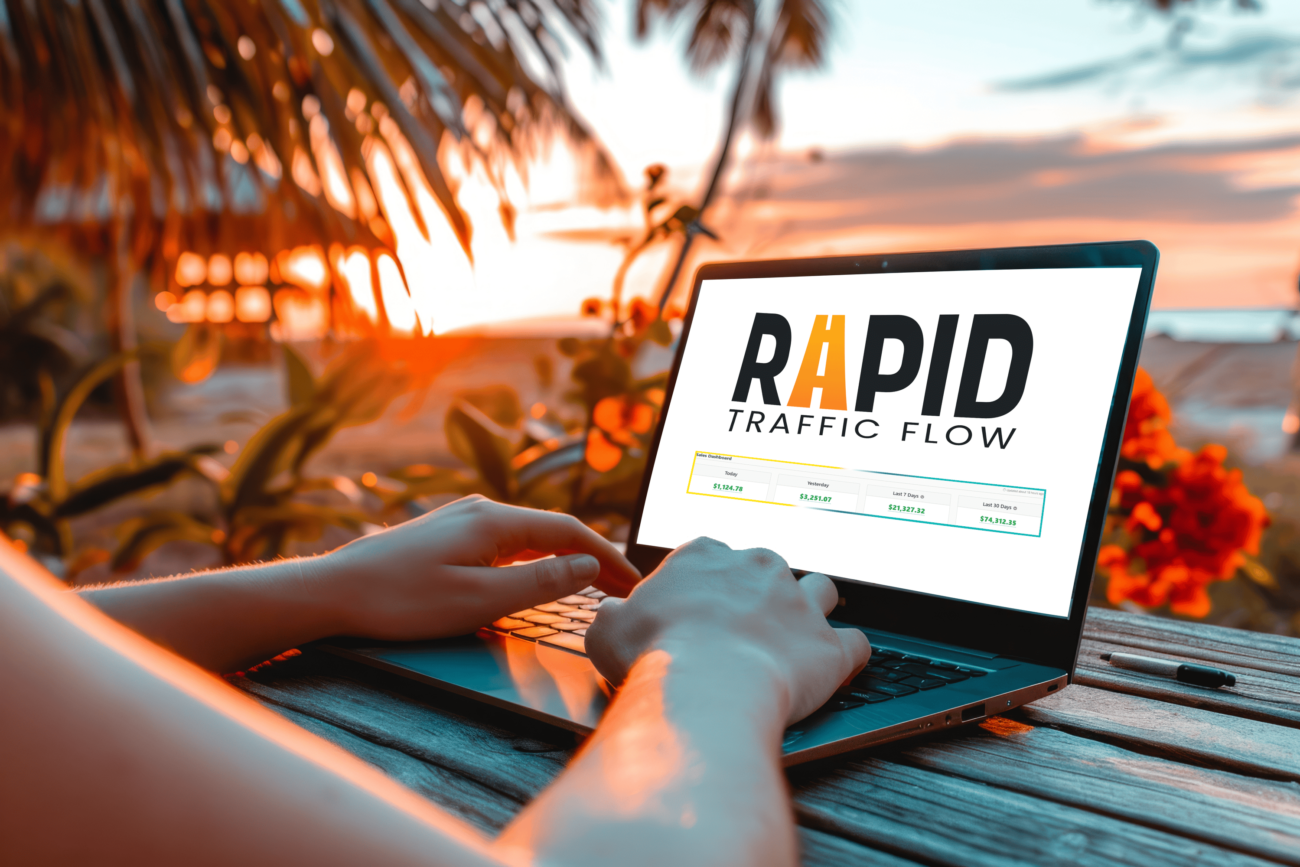 Rapid Traffic Flow logo on a freelancer's laptop screen—discover a free traffic method to grow your online business from anywhere, even a tropical island!
